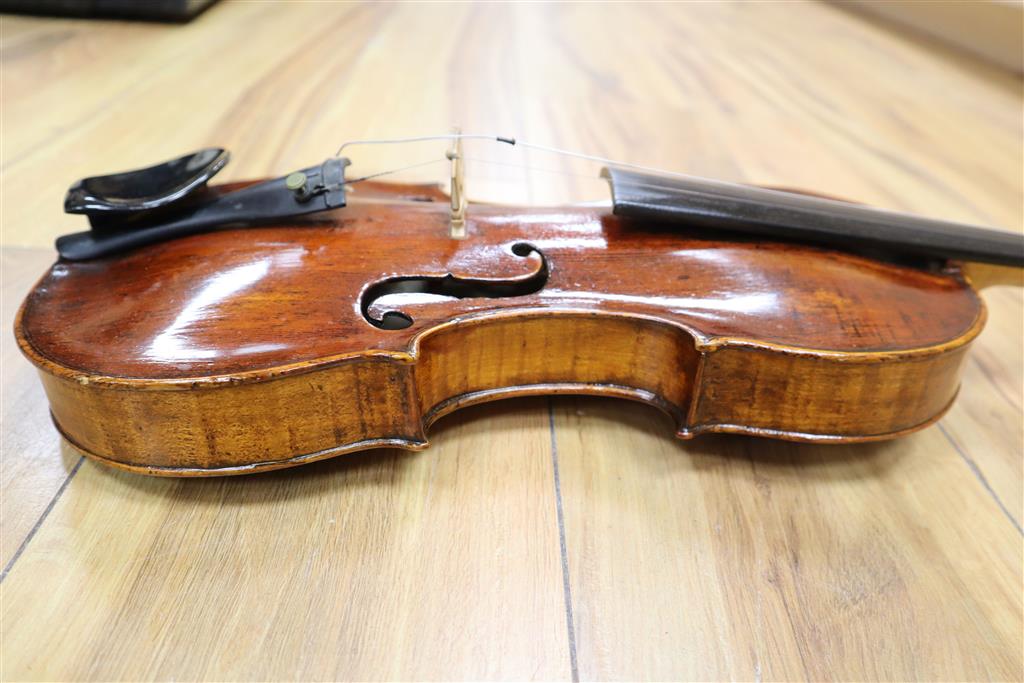 A 19th century Flemish? violin, length of back 35cm, cased with two bows